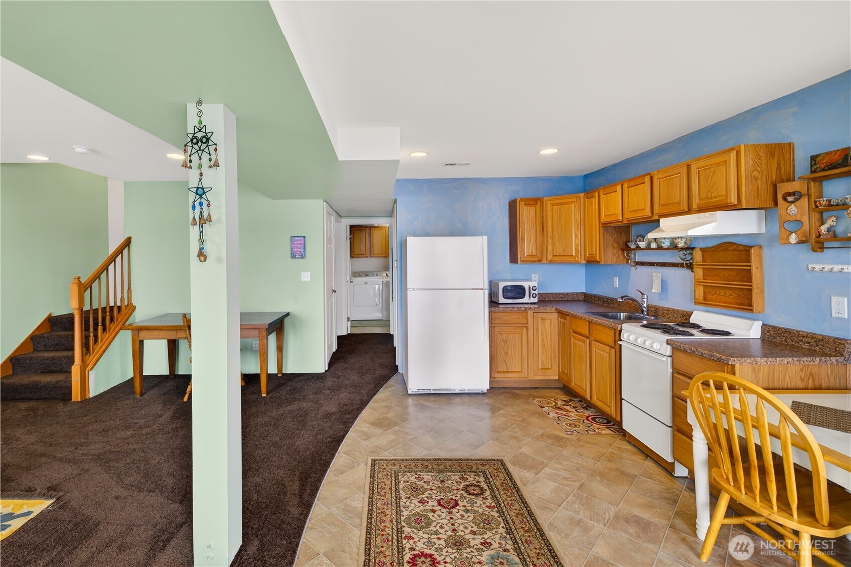 17946 Cobahud Road La Conner, WA 98257 - Photo 35 of 40 a kitchen with stainless steel appliances granite countertop a refrigerator a stove top oven a sink and dishwasher