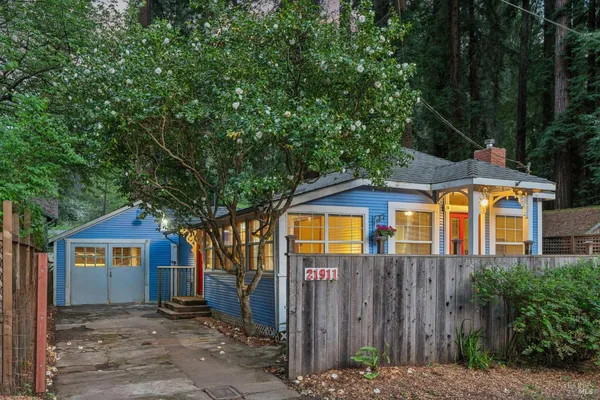 a front view of a house with a garden