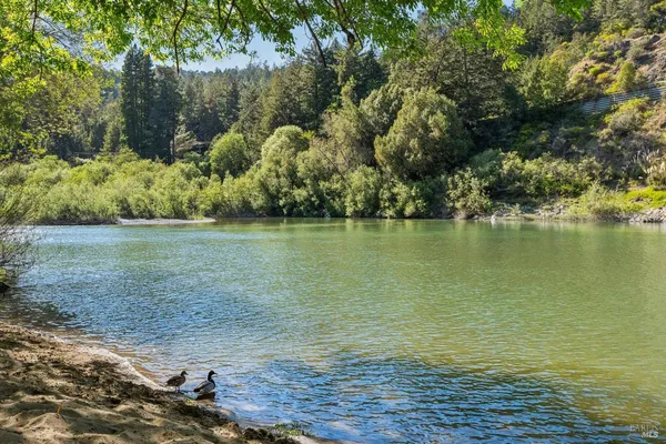 a kitchen with granite countertop a sink and a window