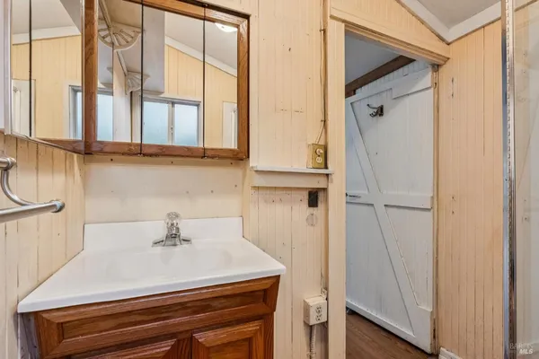 a living room with wooden floors and a fireplace