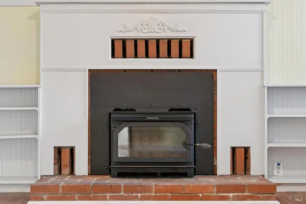 a view of a house with a yard and wooden fence