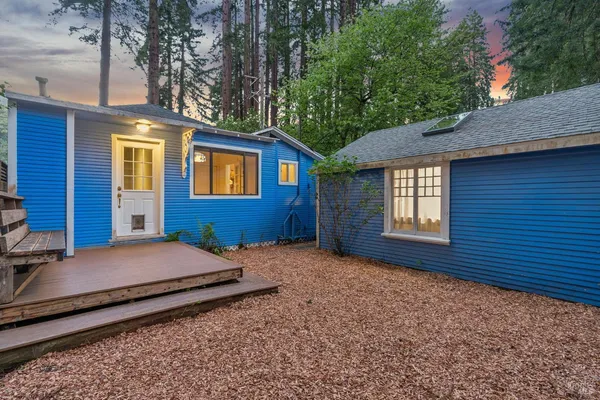 an aerial view of a house with a yard