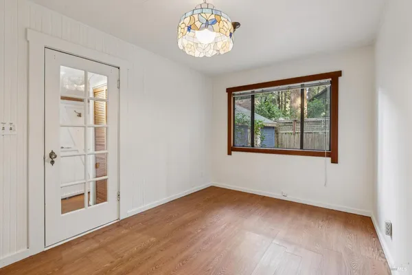 a view of an entryway with wooden floor