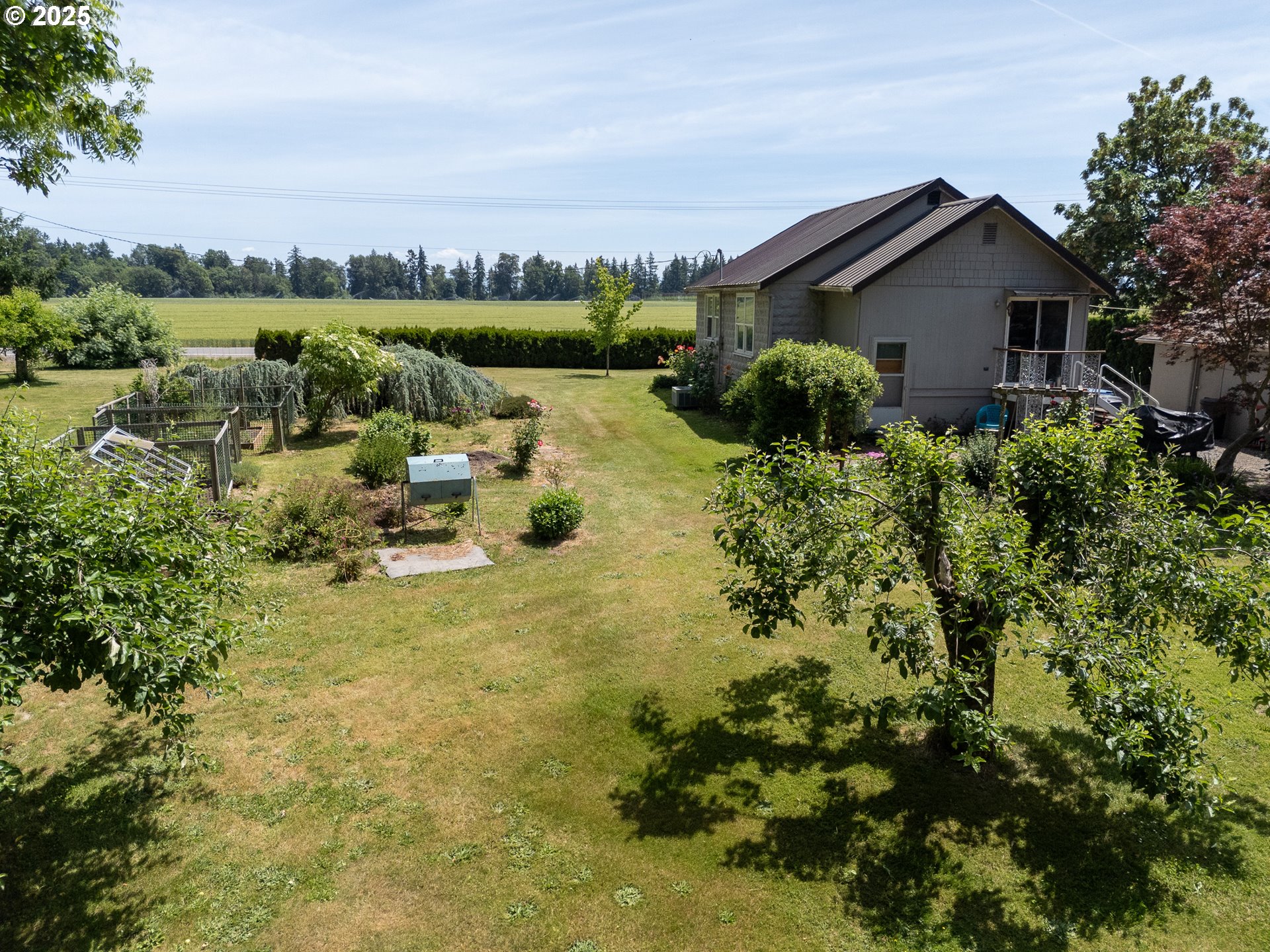 16163 French Prairie Road Northeast Woodburn, OR 97071 - Photo 23 of 47 a view of a house with a yard
