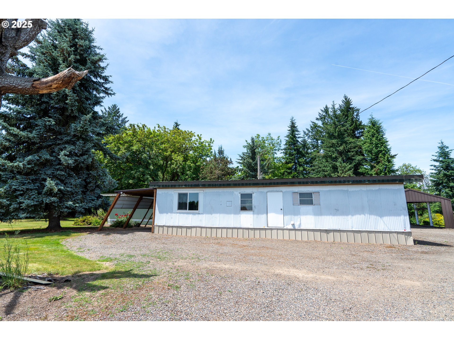 16163 French Prairie Road Northeast Woodburn, OR 97071 - Photo 29 of 47 a view of a house with a yard