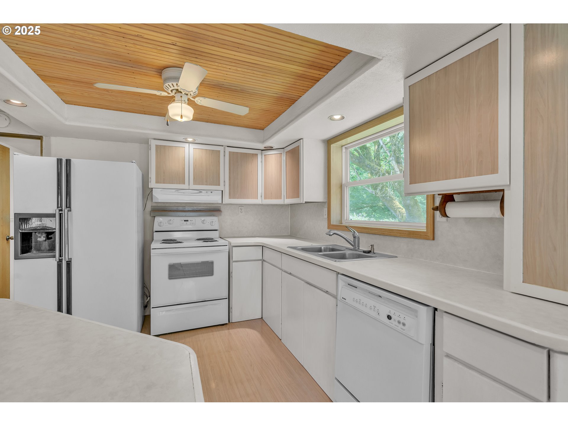 16163 French Prairie Road Northeast Woodburn, OR 97071 - Photo 32 of 47 a kitchen with a sink cabinets stainless steel appliances and a large window