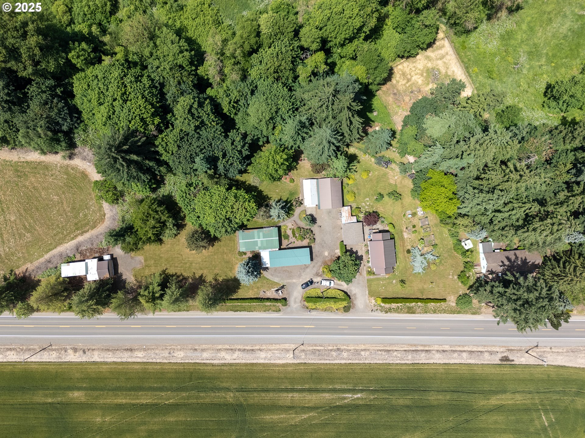 16163 French Prairie Road Northeast Woodburn, OR 97071 - Photo 47 of 47 an aerial view of residential houses with outdoor space and trees
