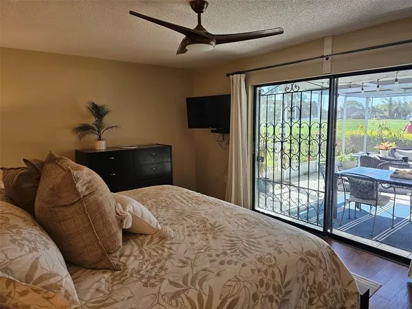 a bathroom with a granite countertop sink mirror vanity and toilet
