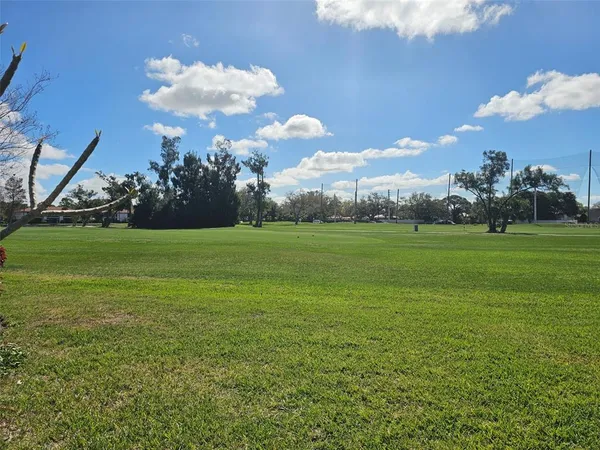 a view of room with window and furniture