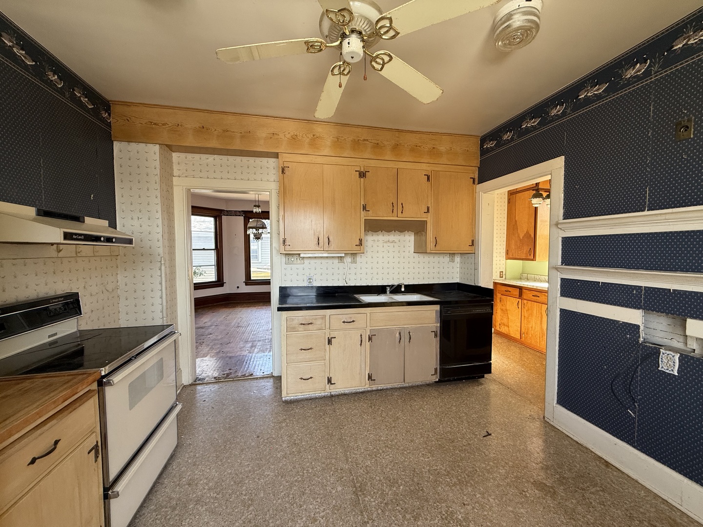 412 West Elm Street Sycamore, IL 60178 - Photo 18 of 35 a kitchen with granite countertop a stove and a sink