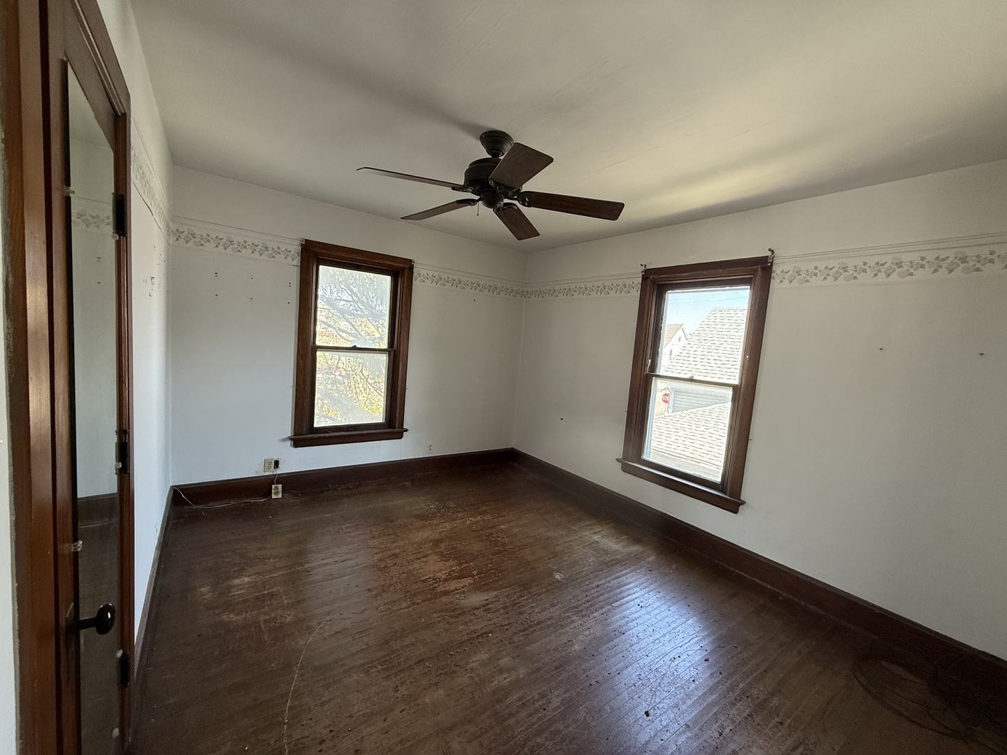 412 West Elm Street Sycamore, IL 60178 - Photo 21 of 35 an empty room with wooden floor and windows