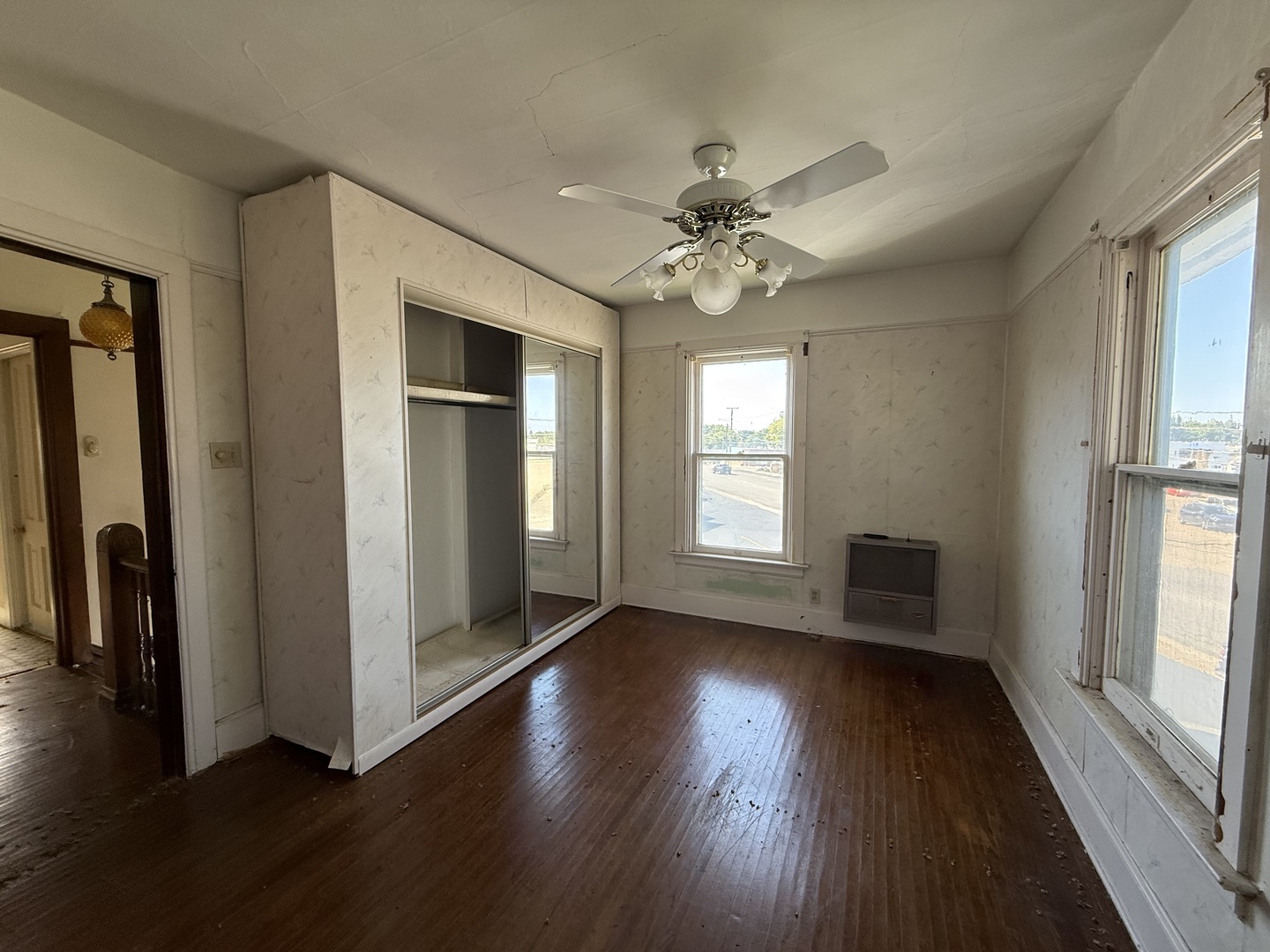 412 West Elm Street Sycamore, IL 60178 - Photo 22 of 35 an empty room with wooden floor fan and windows