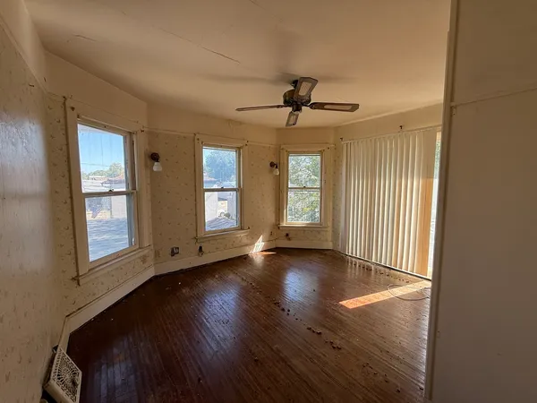 a view of hallway with window and stairs