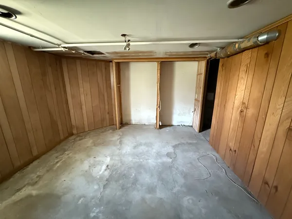 a balcony with table and chairs