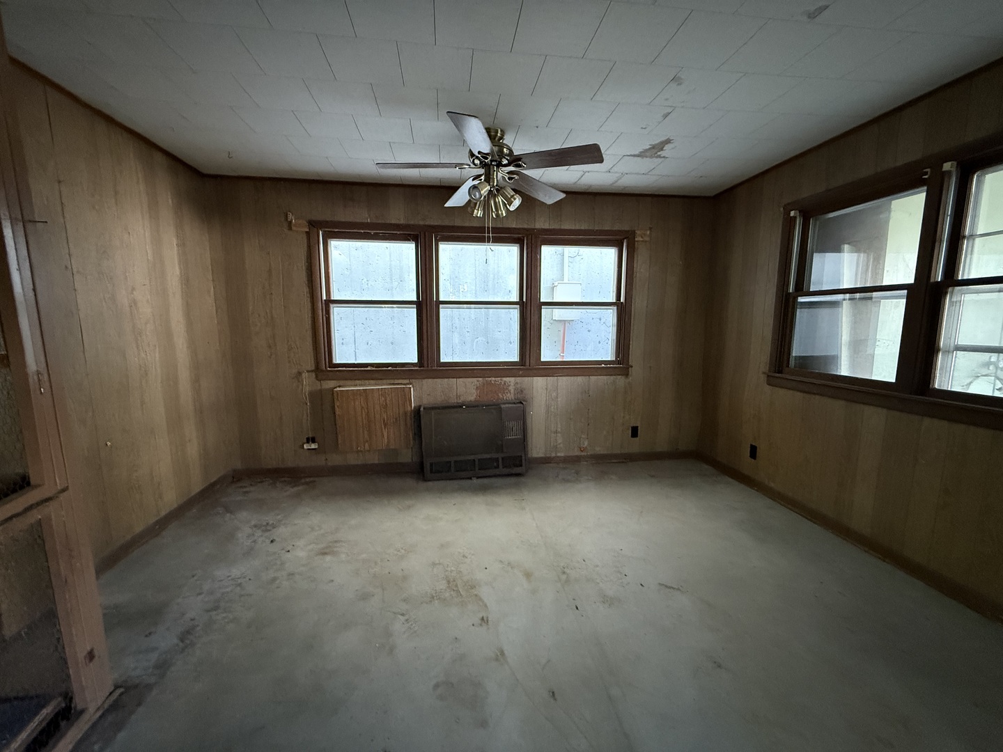 412 West Elm Street Sycamore, IL 60178 - Photo 34 of 35 an empty room with chandelier fan and windows