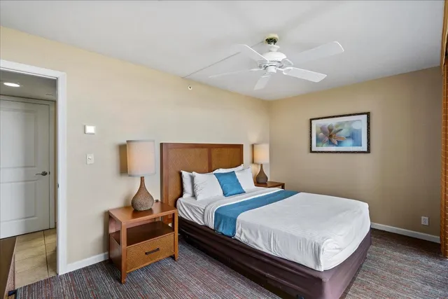 a bedroom with bed and a chandelier