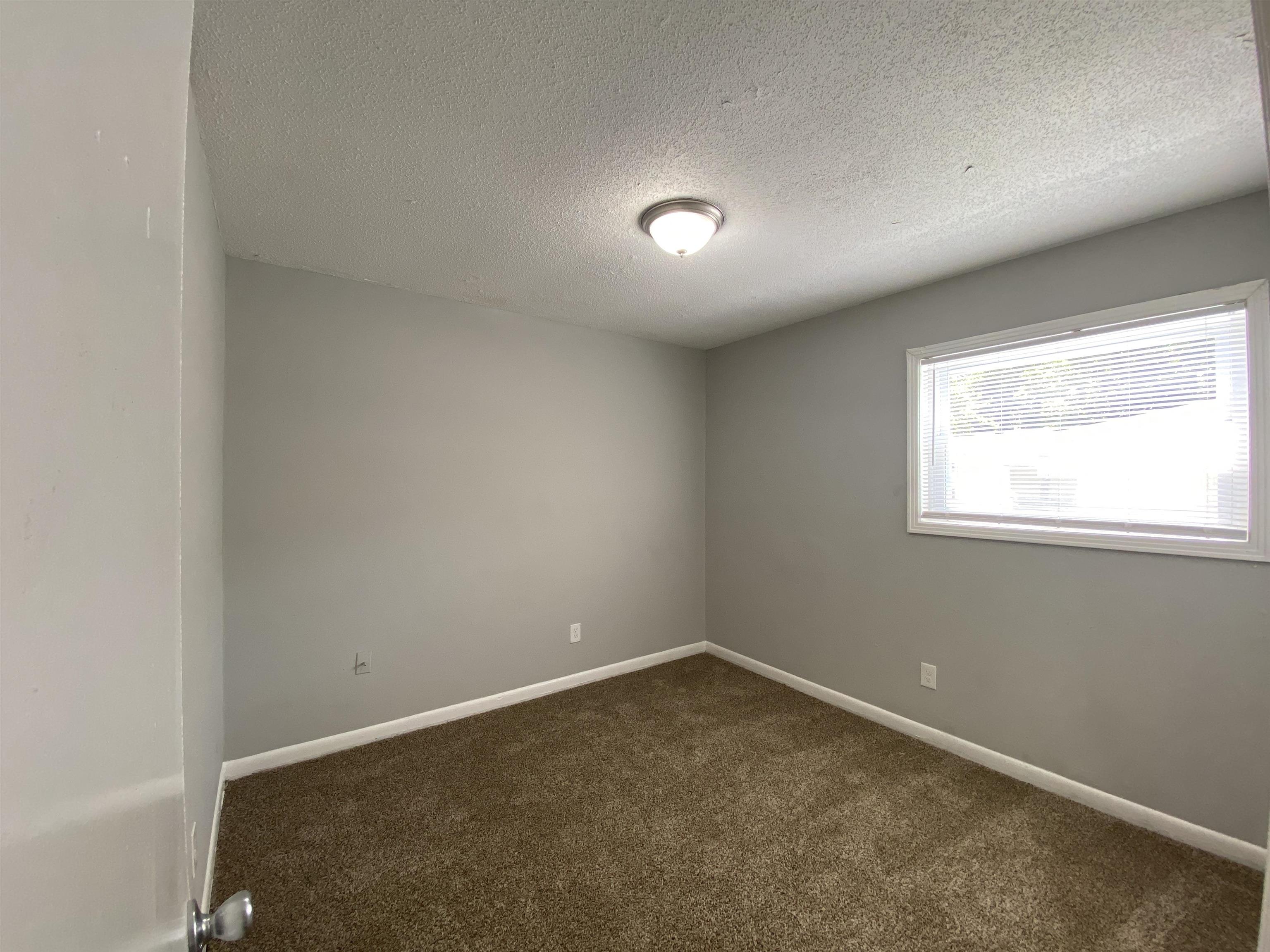 667 West Raines Road Memphis, TN 38109 - Photo 15 of 15 an empty room with a window