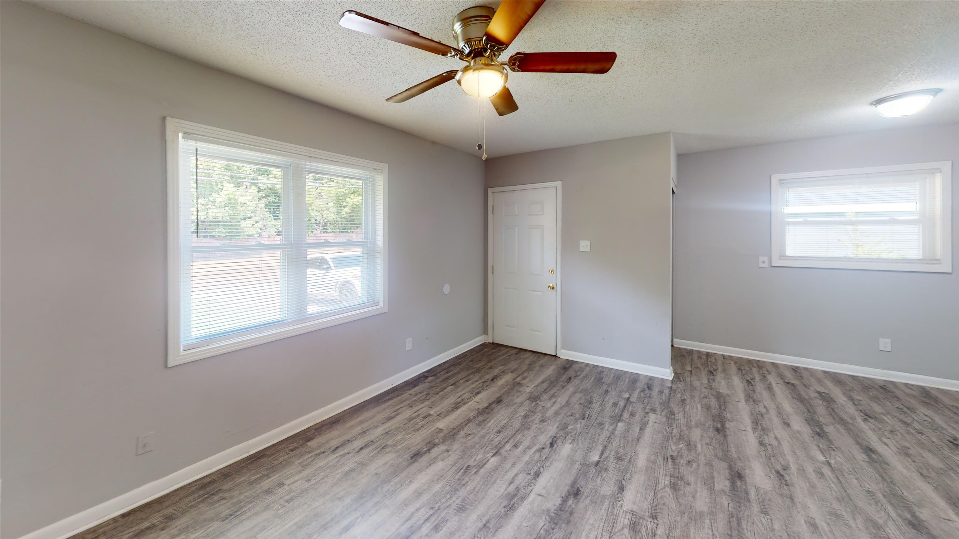 667 West Raines Road Memphis, TN 38109 - Photo 4 of 15 wooden floor in an empty room with a window
