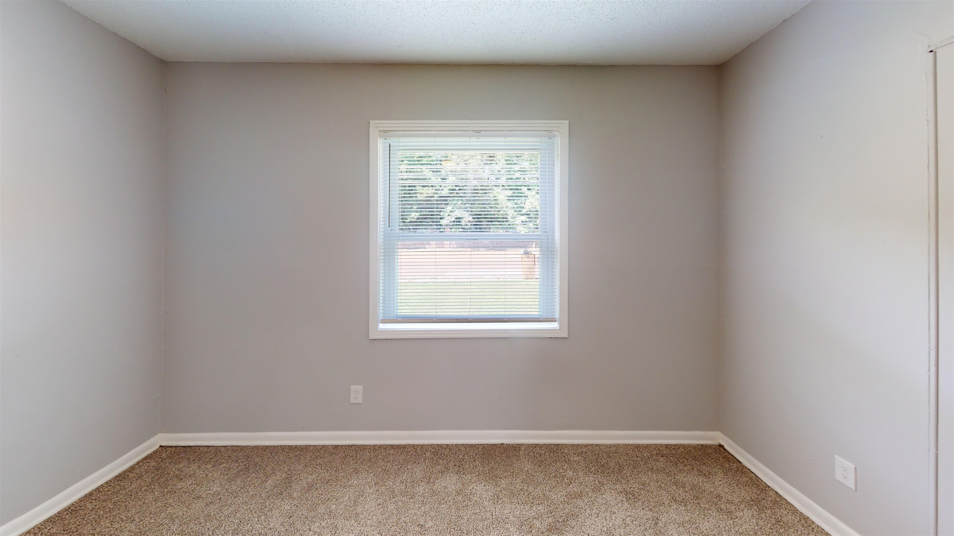 667 West Raines Road Memphis, TN 38109 - Photo 6 of 15 an empty room with a window