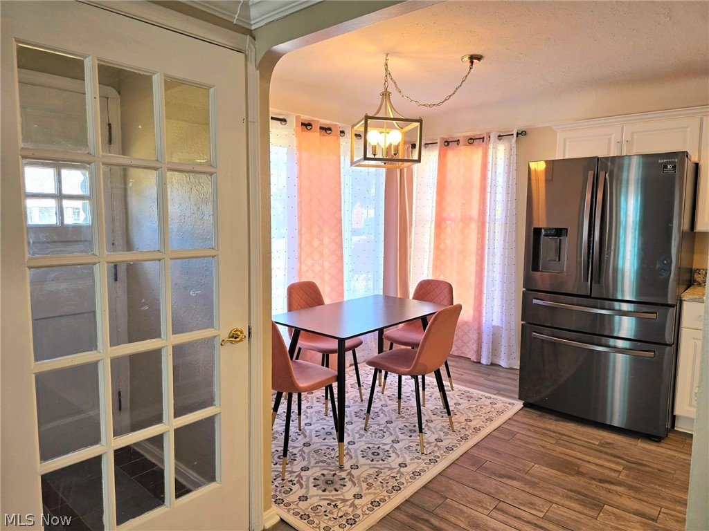 4111 Redfern Road Parma, OH 44134 - Photo 7 of 40 Dining room featuring a modern chandelier