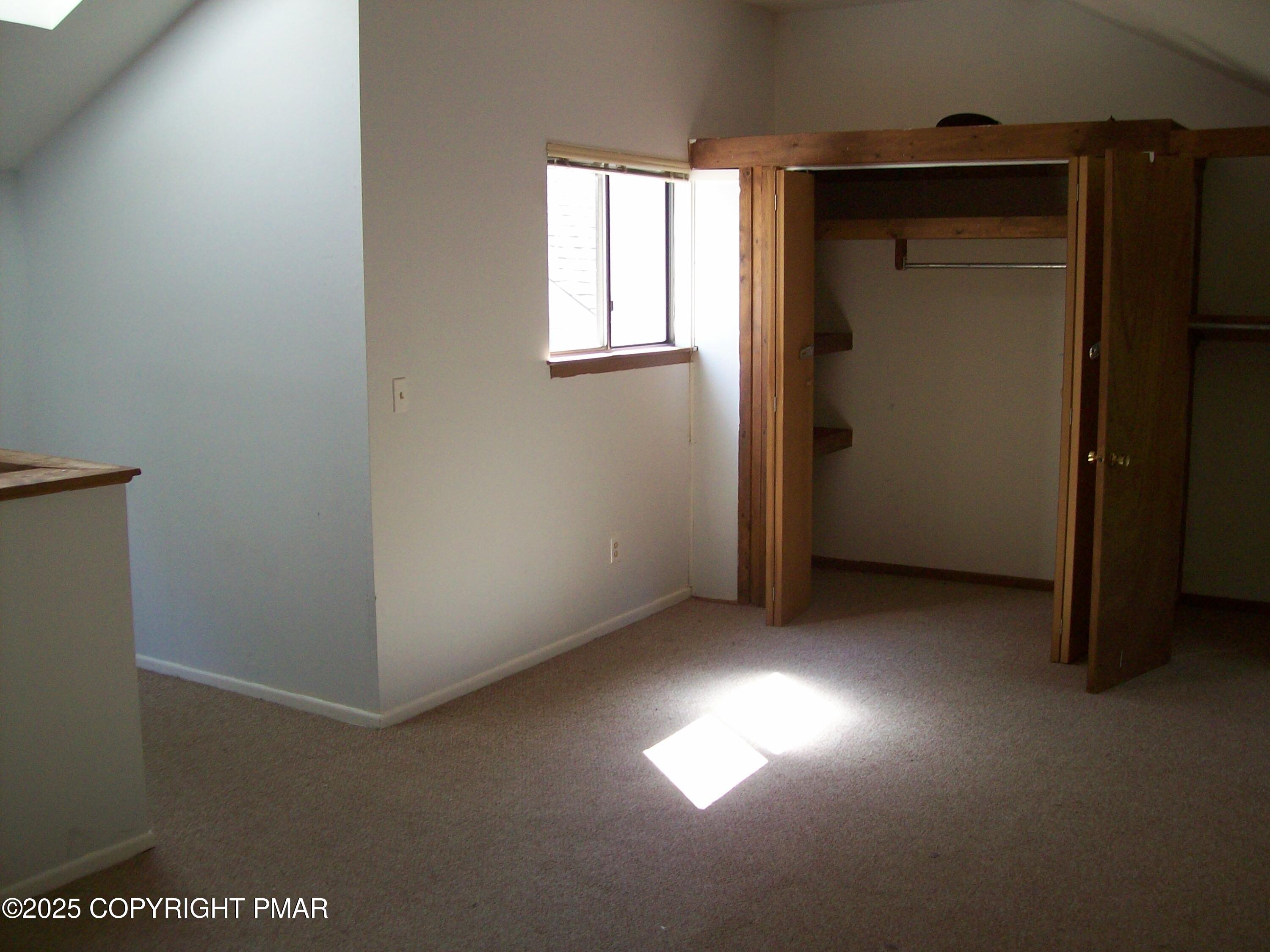 3314 Windermere Drive Bushkill, PA 18324 - Photo 16 of 23 an empty room with windows and closet