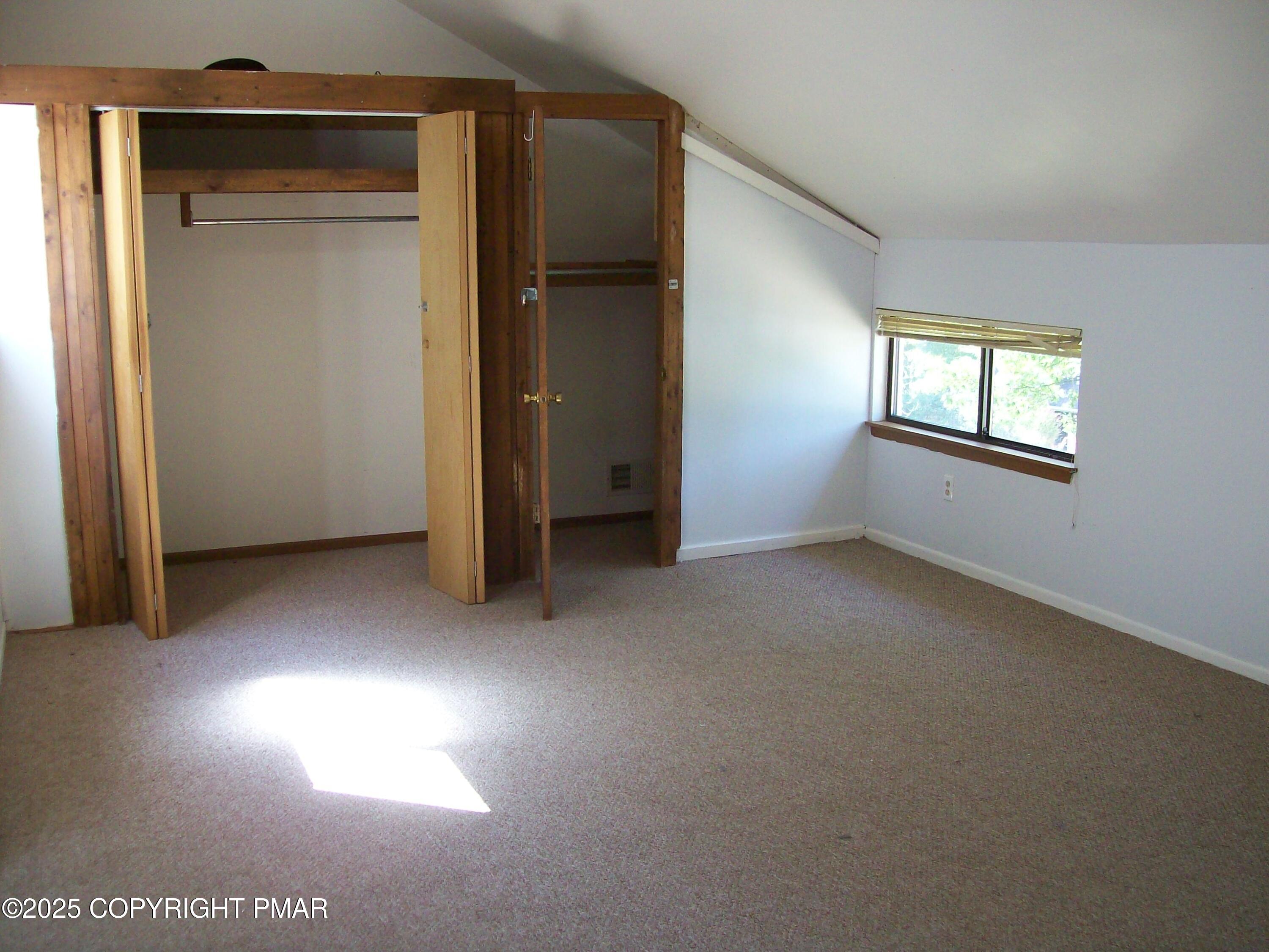 3314 Windermere Drive Bushkill, PA 18324 - Photo 17 of 23 an empty room with windows and closet
