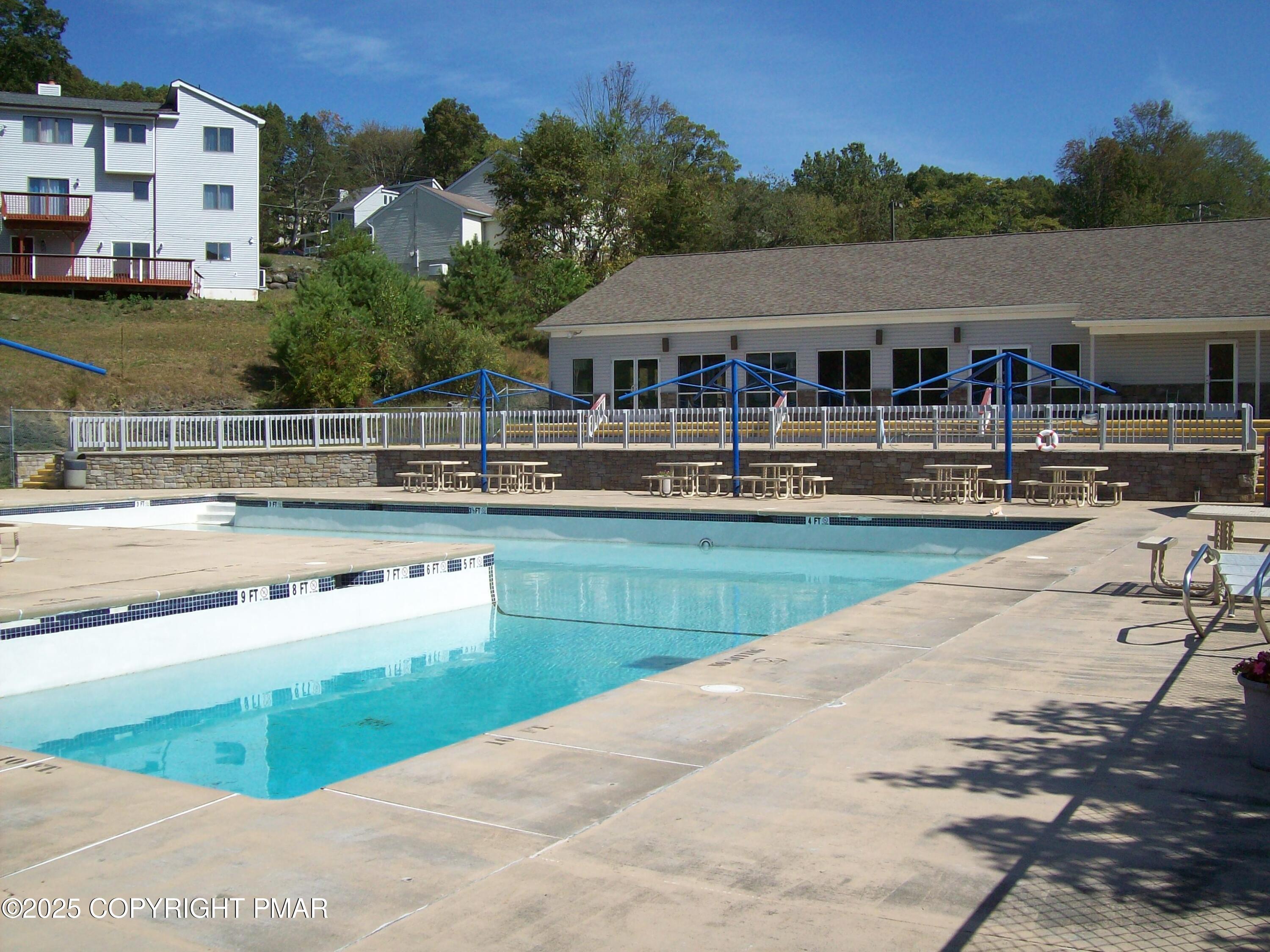3314 Windermere Drive Bushkill, PA 18324 - Photo 20 of 23 a aerial view of a house with swimming pool and a yard