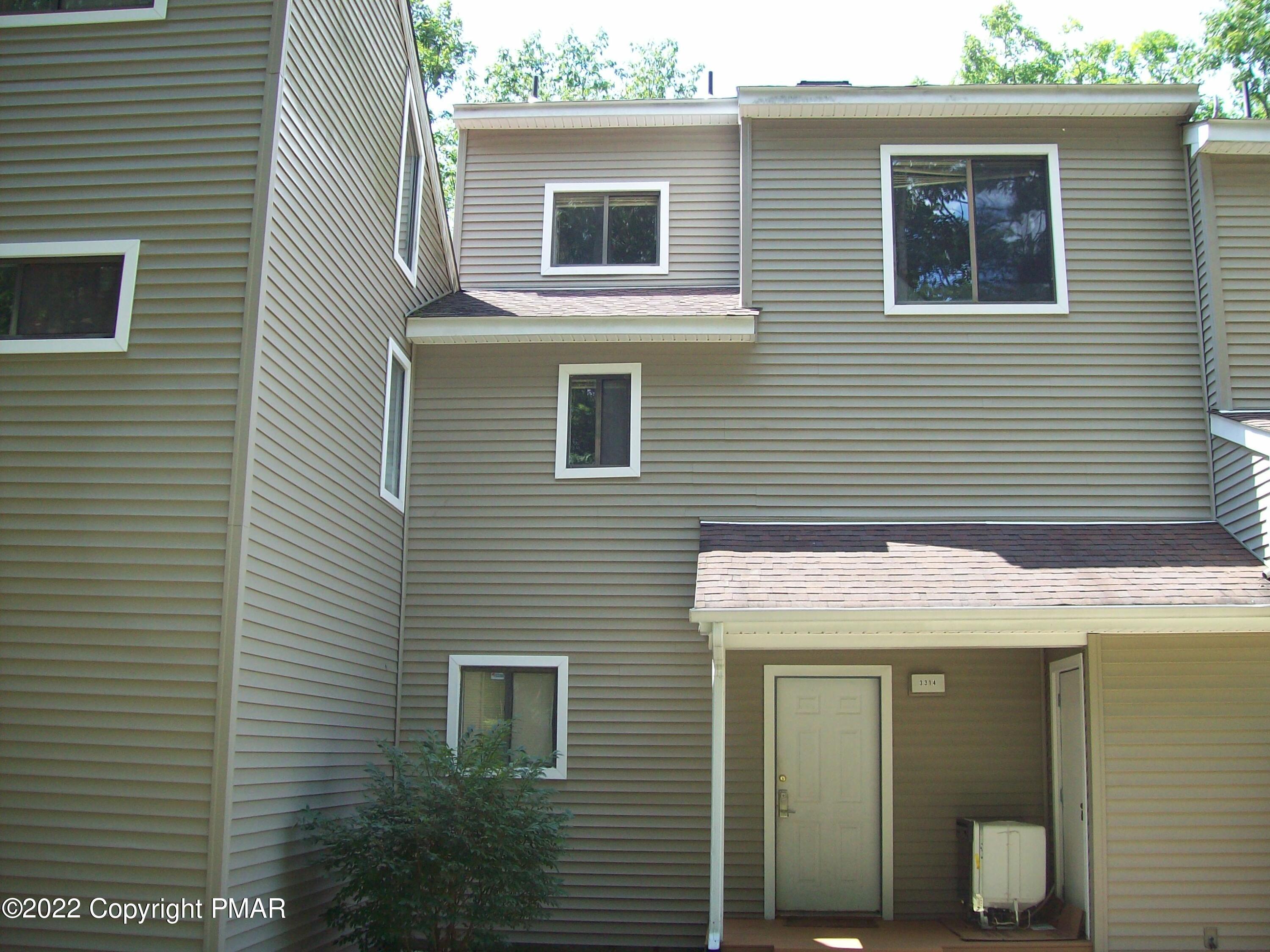 3314 Windermere Drive Bushkill, PA 18324 - Photo 2 of 23 a front view of a house with a garage