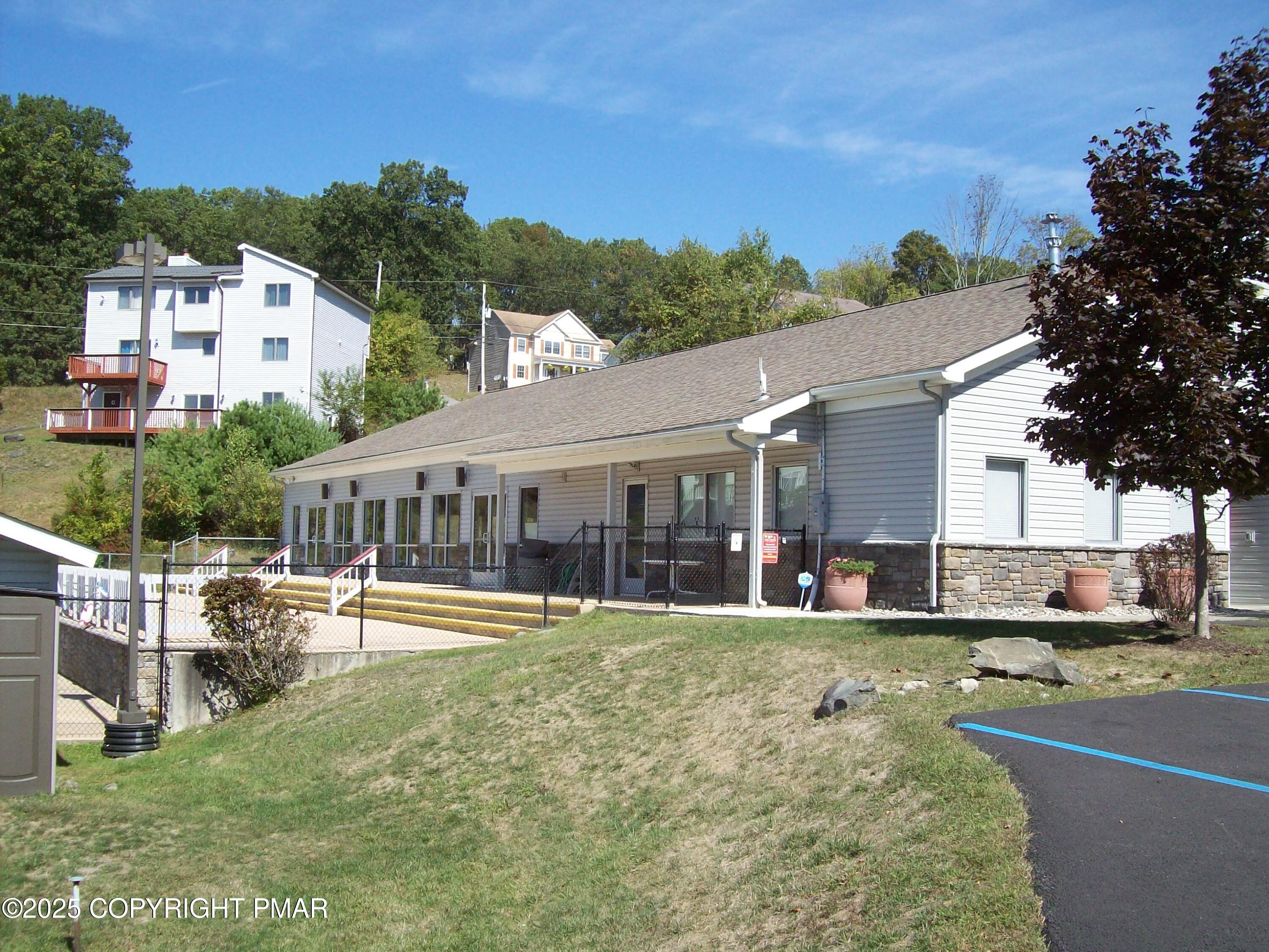 3314 Windermere Drive Bushkill, PA 18324 - Photo 21 of 23 a view of a house with a swimming pool