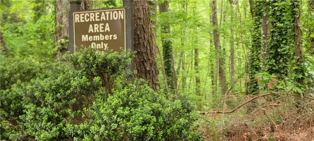 a sign broad in front of a yard
