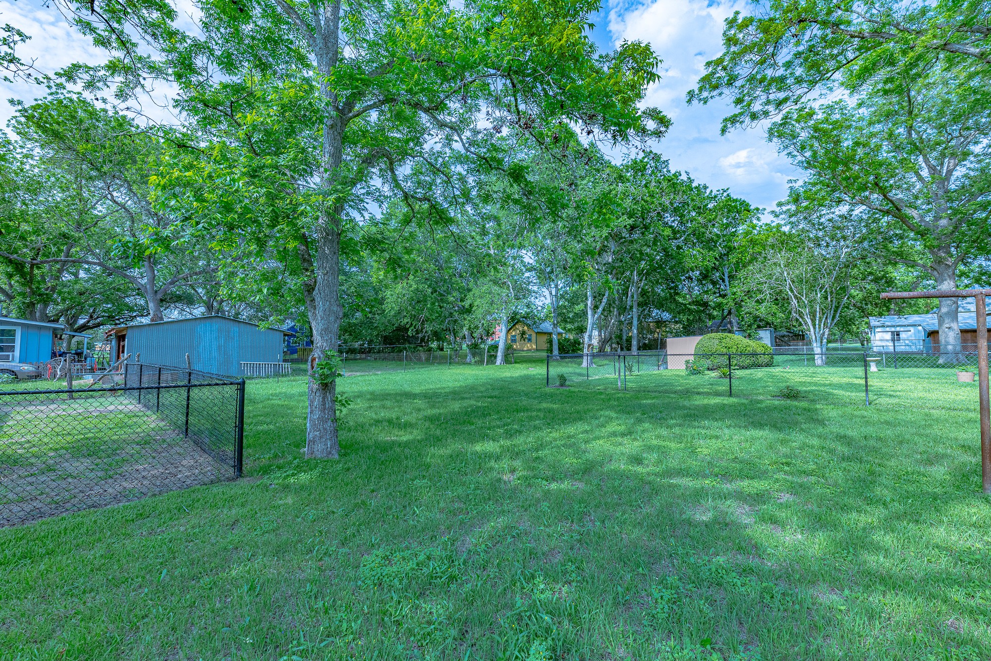 421 West Runk Street Shiner, TX 77984 - Photo 16 of 18 a view of a garden with a slide