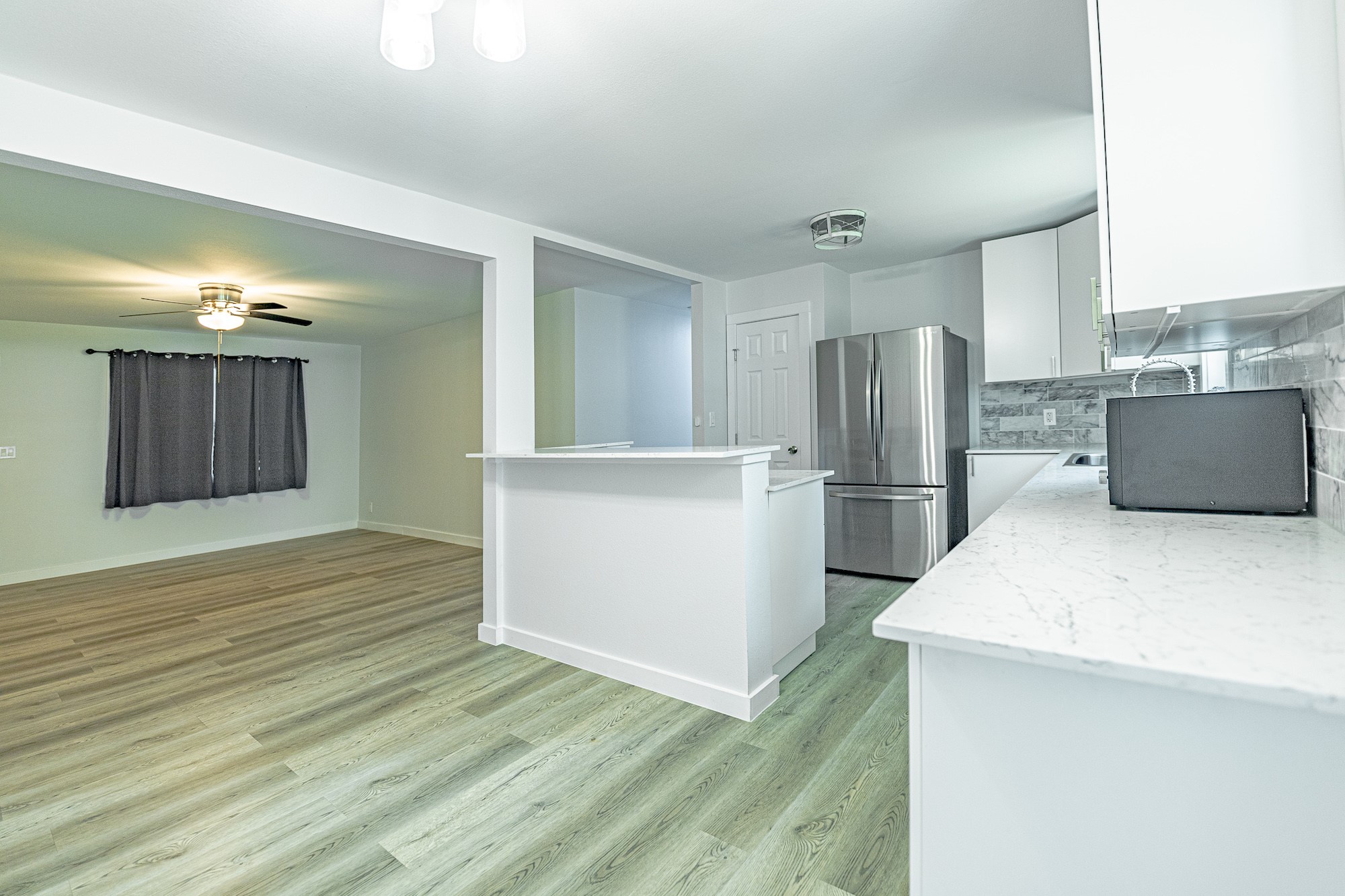 421 West Runk Street Shiner, TX 77984 - Photo 6 of 18 a kitchen with stainless steel appliances a refrigerator and a stove top oven