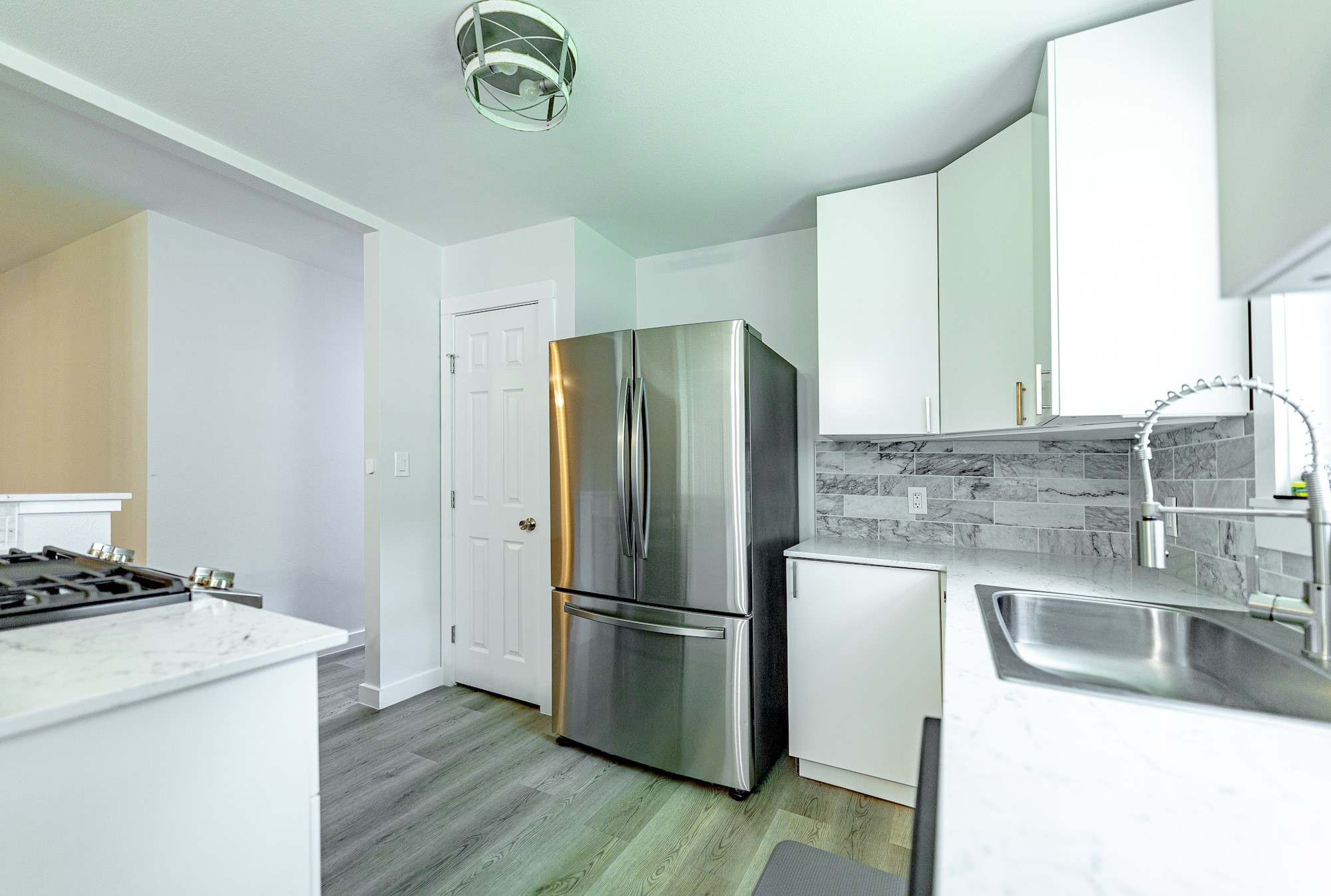 421 West Runk Street Shiner, TX 77984 - Photo 8 of 18 a kitchen with a refrigerator and a sink