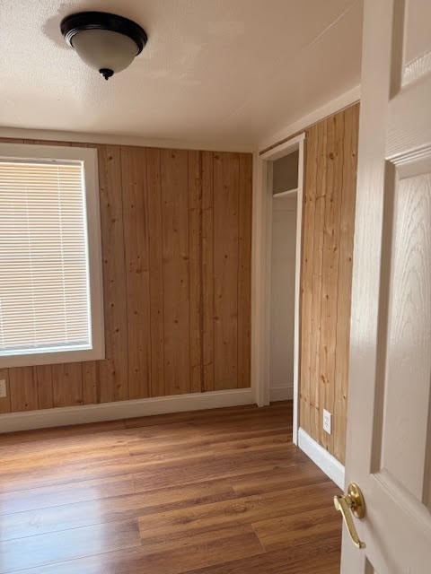 15110 Firetower Road Conroe, TX 77306 - Photo 11 of 14 an empty room with wooden floor and windows