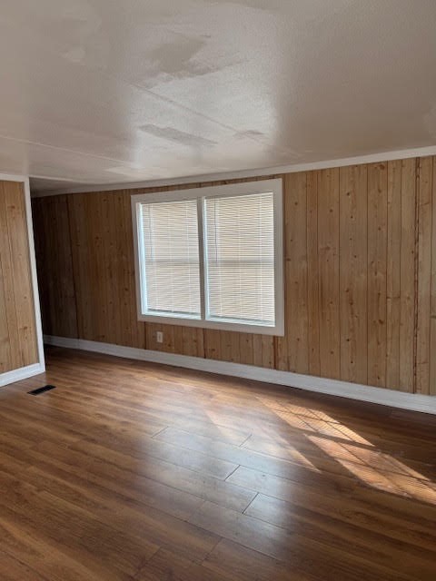 15110 Firetower Road Conroe, TX 77306 - Photo 8 of 14 a view of an empty room with wooden floor and a window
