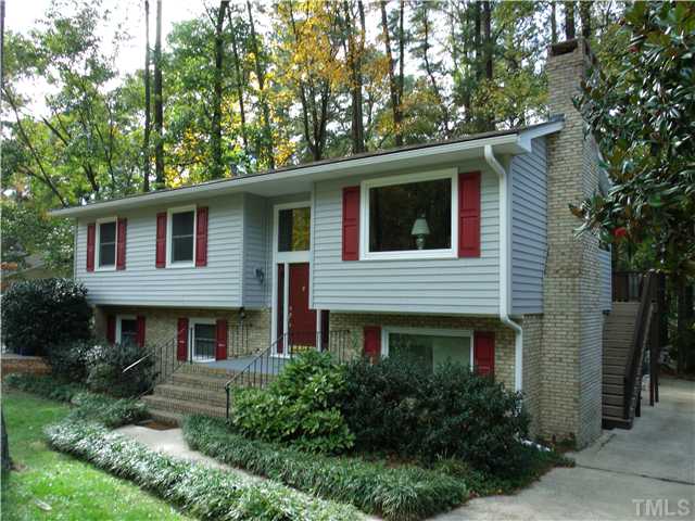 4509 Waterbury Road Raleigh, NC 27604 - Photo 1 of 13 a front view of a house with garden
