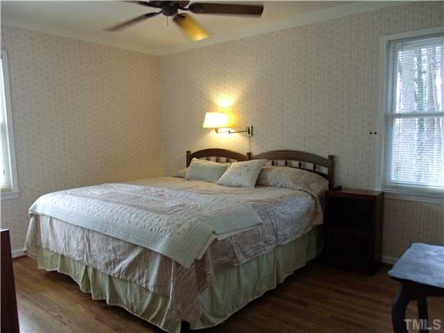 4509 Waterbury Road Raleigh, NC 27604 - Photo 11 of 13 a bedroom with a bed and a window