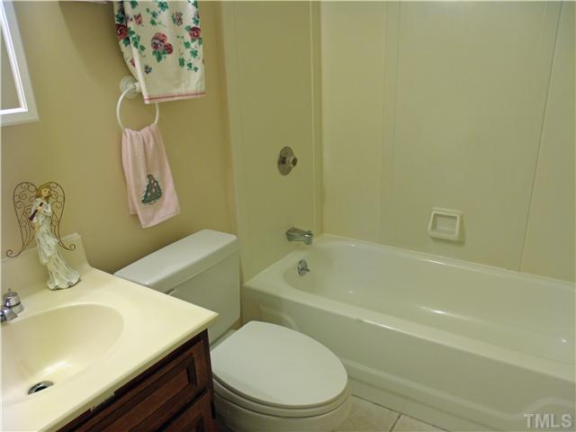 4509 Waterbury Road Raleigh, NC 27604 - Photo 13 of 13 a bathroom with a sink and a mirror