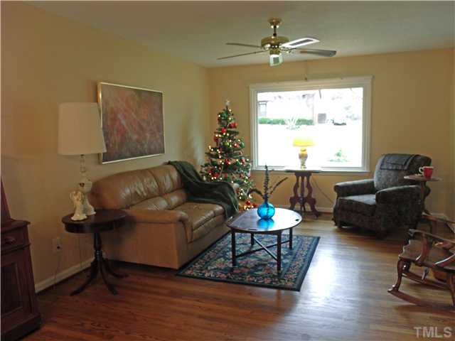 4509 Waterbury Road Raleigh, NC 27604 - Photo 3 of 13 a living room with furniture and a window