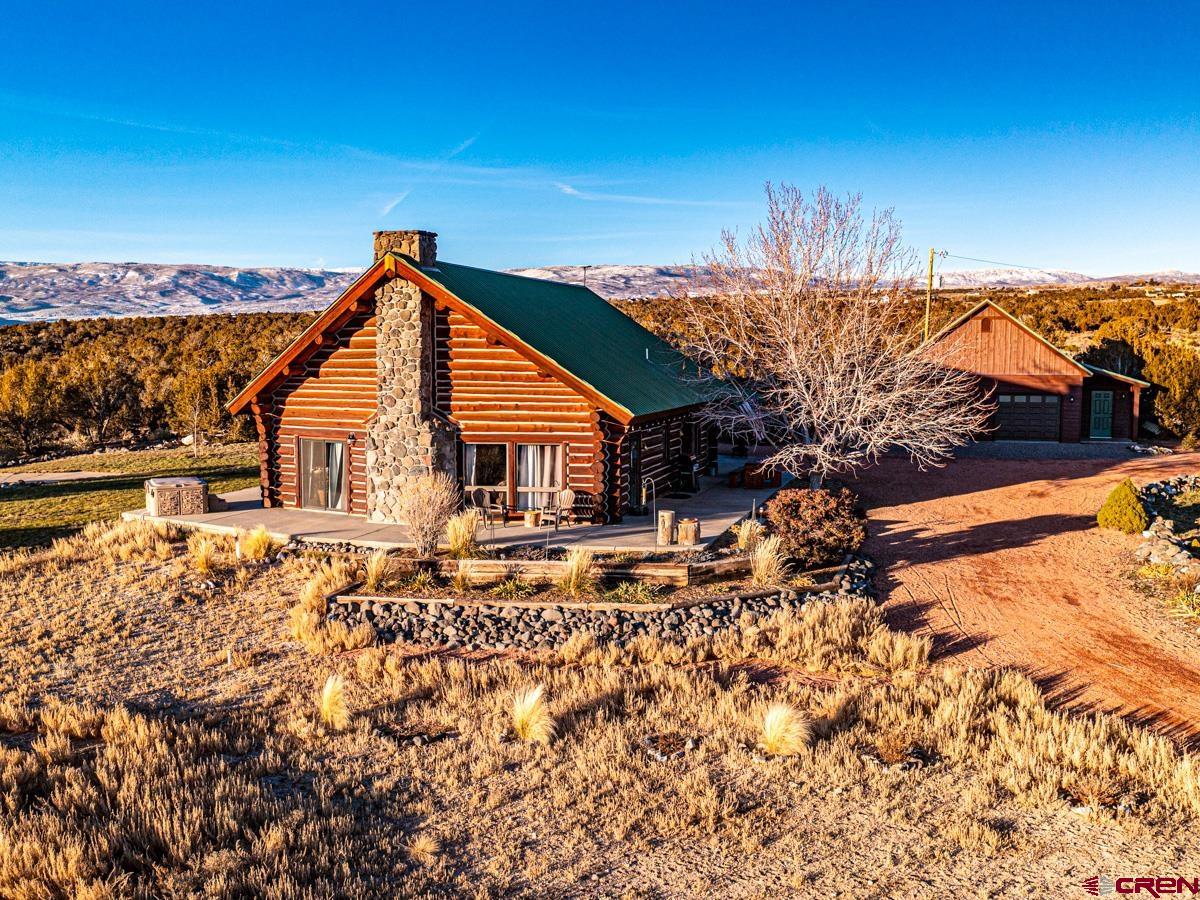 15371 2525th Road Cedaredge, CO 81413 - Photo 4 of 35 a view of a house with a yard