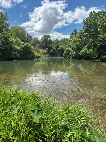 a view of a lake with a city