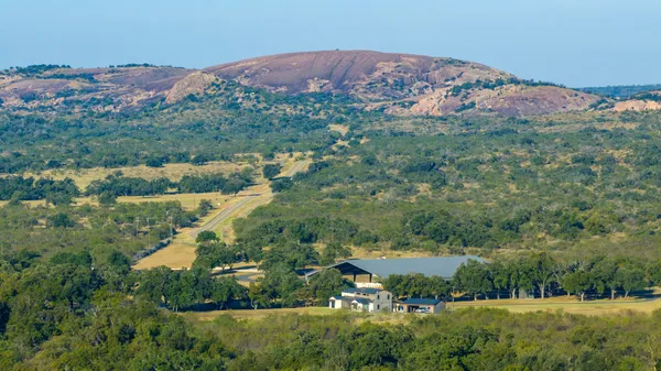 an aerial view of a house with a garden