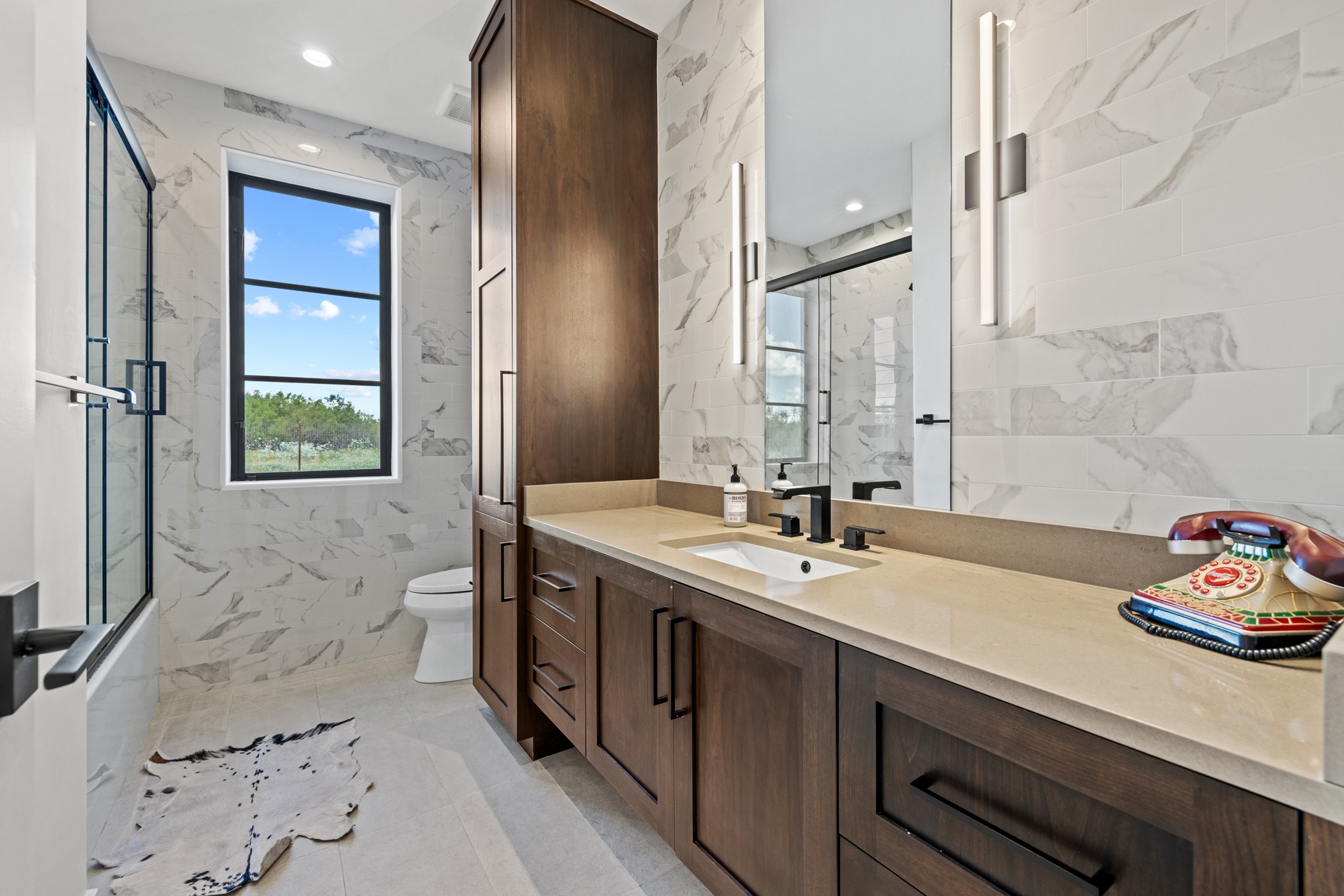 5862 Ranch Road 965 Llano, TX 78643 - Photo 21 of 40 a bathroom with a sink double vanity and a tub
