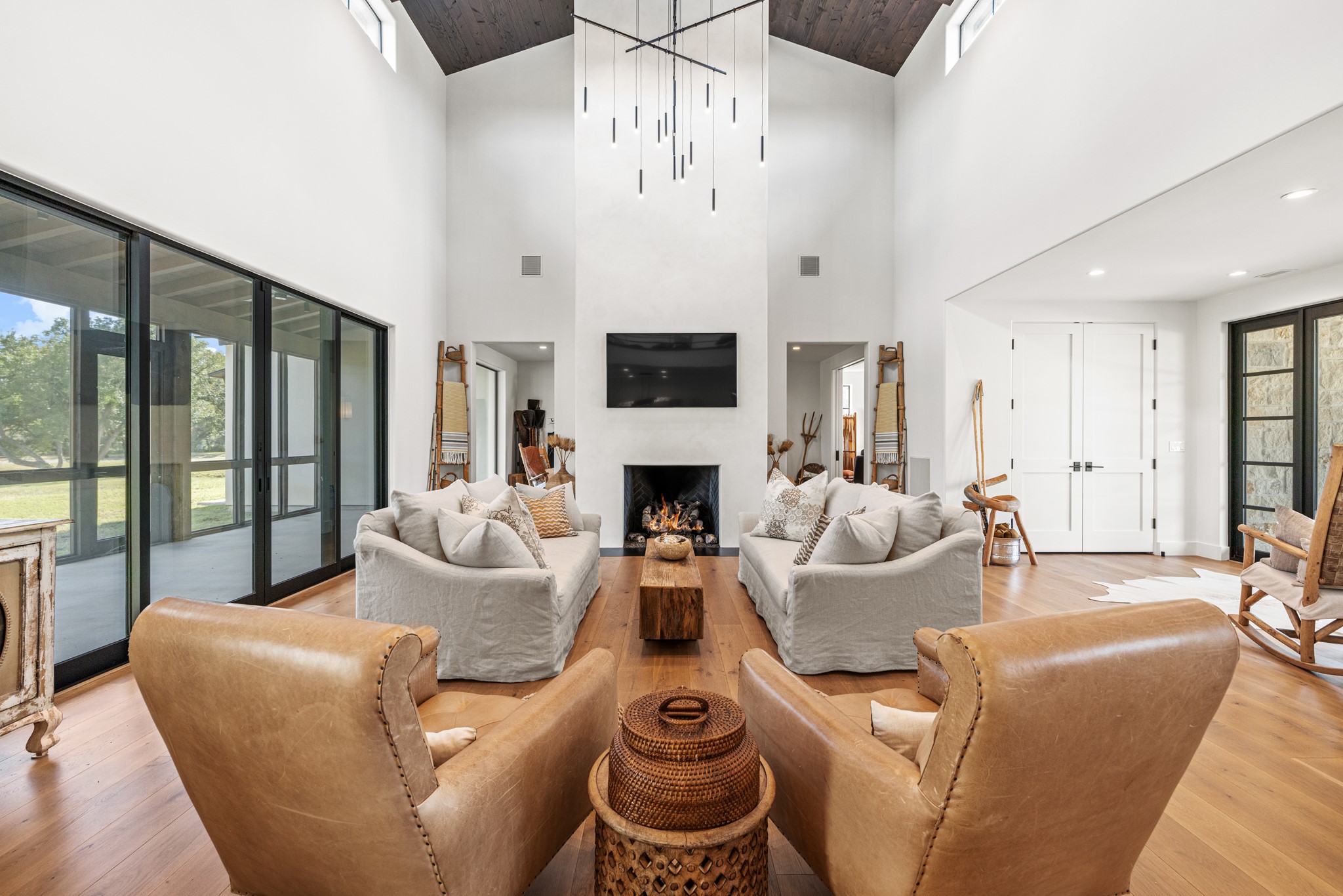 5862 Ranch Road 965 Llano, TX 78643 - Photo 10 of 40 a living room with furniture a fireplace and a flat screen tv