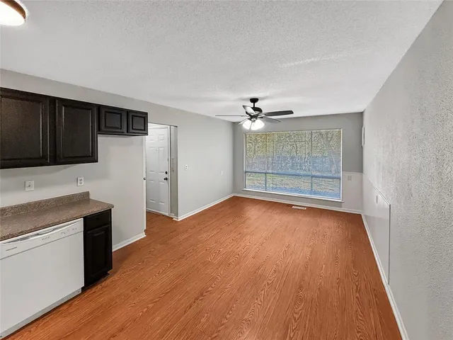 a view of a kitchen with a sink microwave and refrigerator