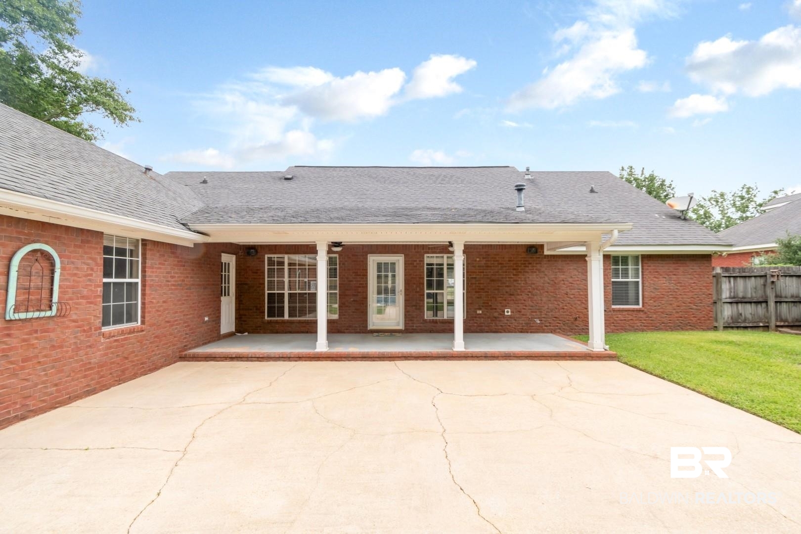10691 Hunters Ridge Drive Mobile, AL 36695 - Photo 34 of 37 Expansive concrete patio area extending from the brick exterior