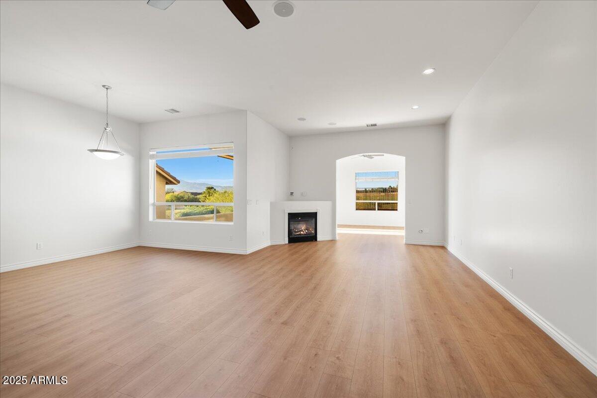 970 South Golf View Drive Cornville, AZ 86325 - Photo 21 of 48 an empty room with window and fireplace