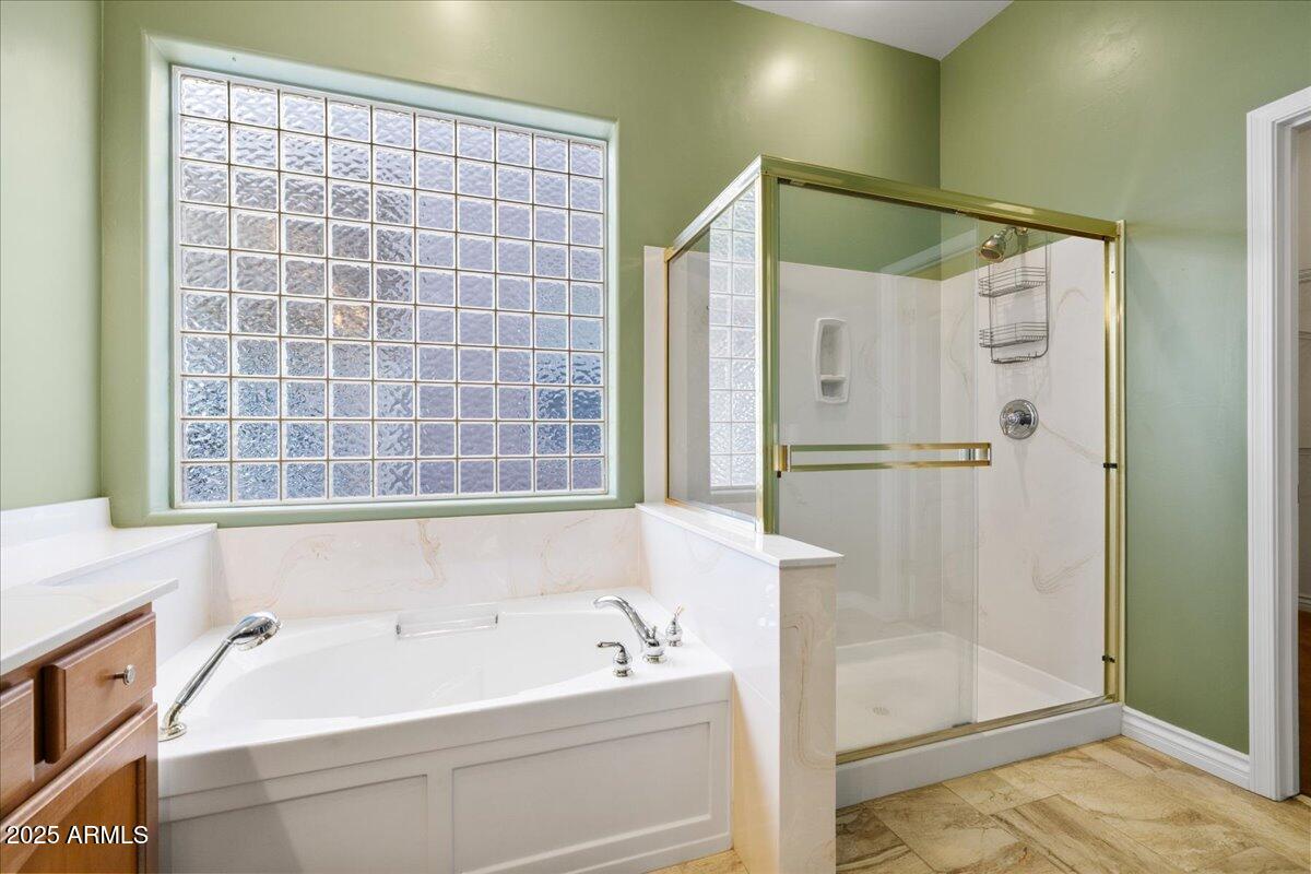 970 South Golf View Drive Cornville, AZ 86325 - Photo 38 of 48 a bathroom with a bathtub and a shower