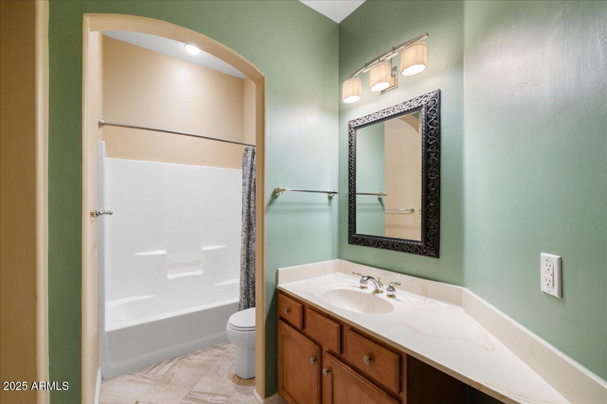 970 South Golf View Drive Cornville, AZ 86325 - Photo 42 of 48 a bathroom with a sink a mirror and a shower
