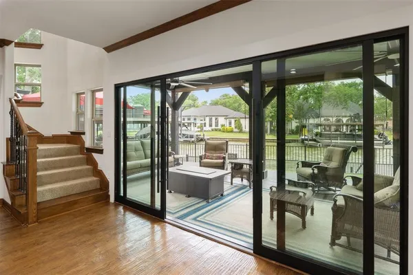 a view of an entryway with wooden floor and windows